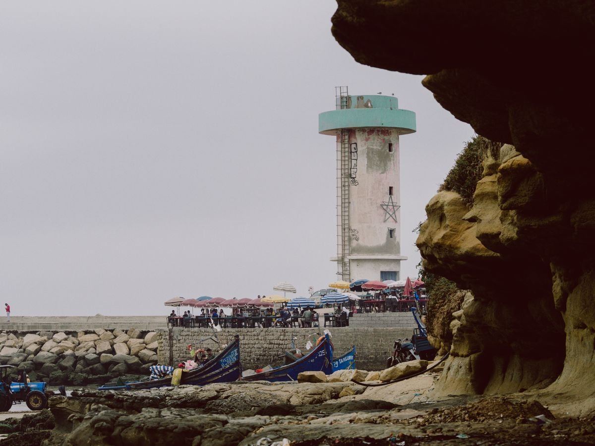 Imsouane bay, lighthouse and fishing boats on the Moroccan coast