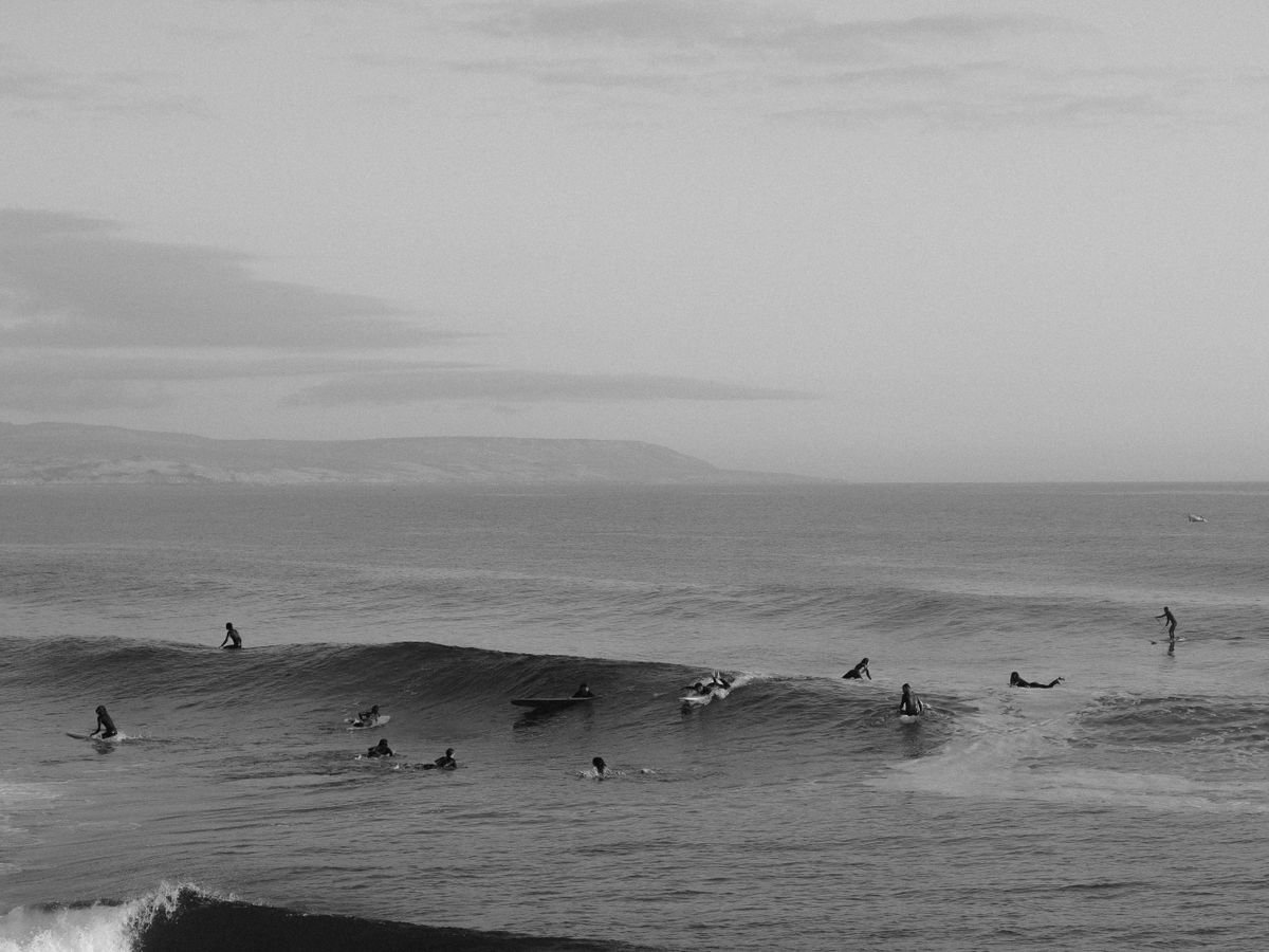 Surfers in the water at Imsouane, Souss-Massa