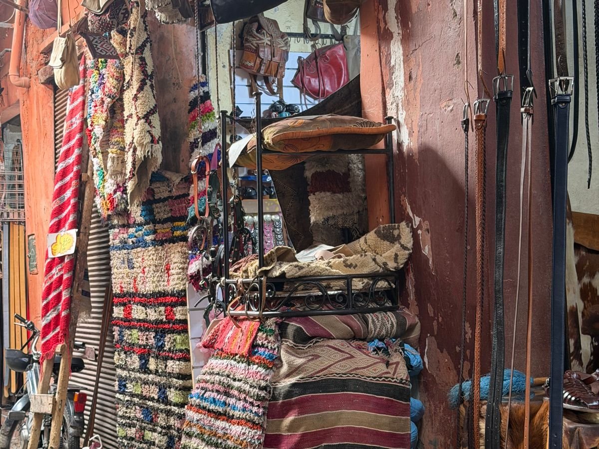 Textiles and goods in a Moroccan market street