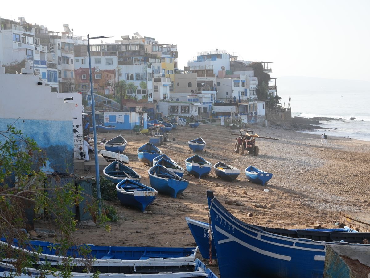Blue fishing boats on the sand at Taghazout