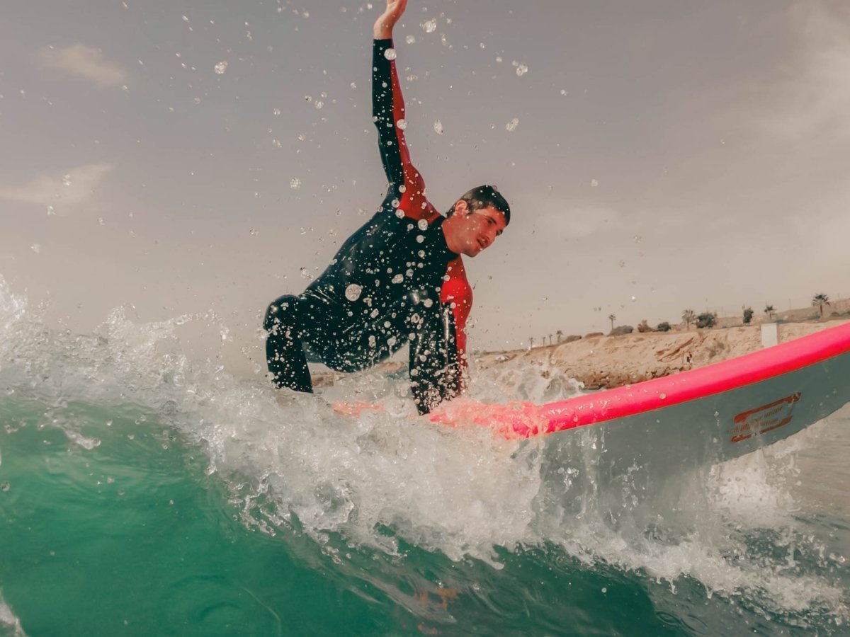 Surfer riding a wave at Taghazout